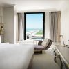 Cozy Bedding and Contemporary Decor in a Guest Room